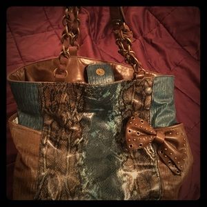 Snakeskin patent bag.